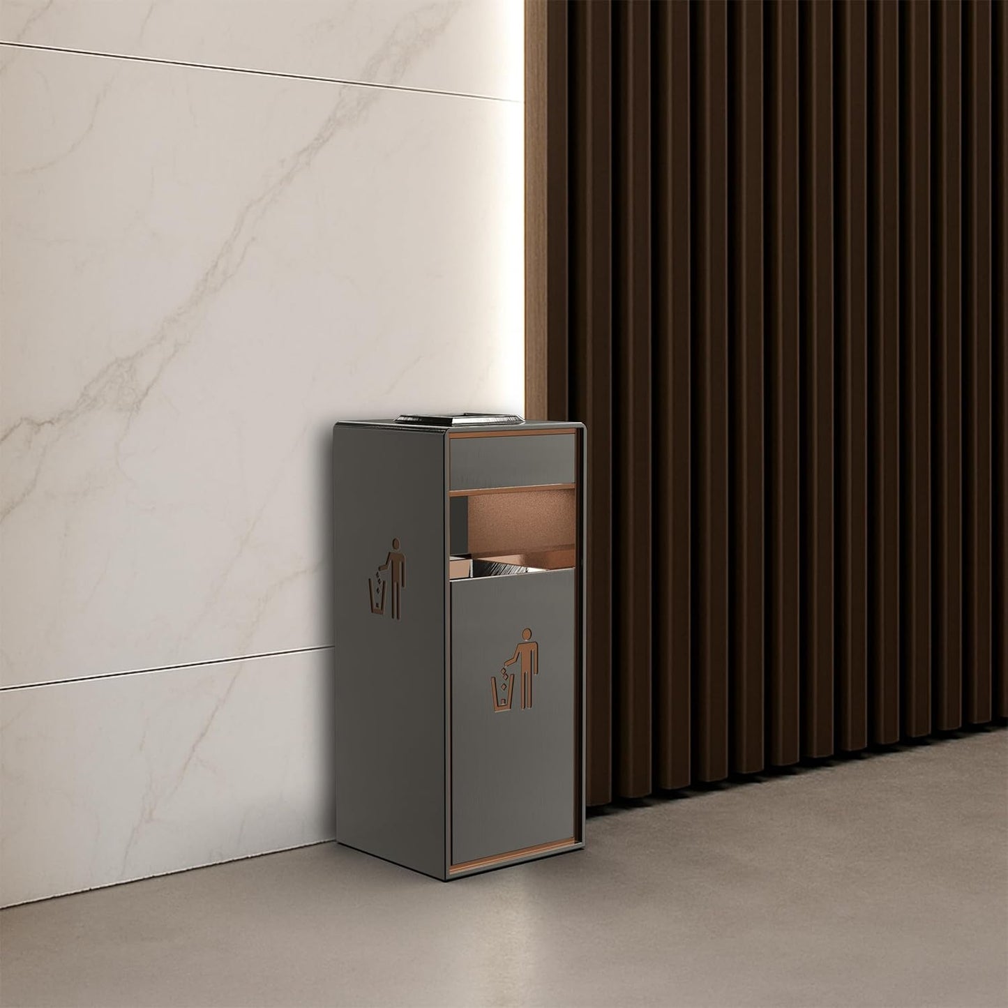 Gray lockable garbage bin with copper details placed against marble wall and wooden slat background in contemporary interior setting