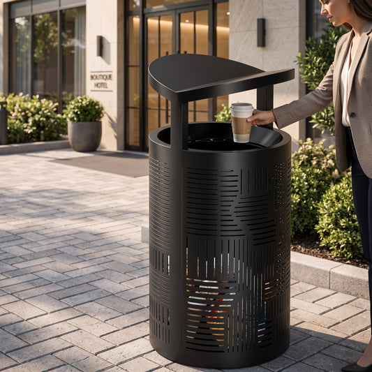 Outdoor commercial trash can at a hotel entrance showing how outdoor trash can odor can begin before the bin is full