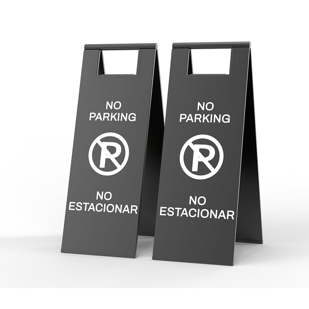Two gray no parking signs with prohibited symbol and bilingual English Spanish text for parking enforcement