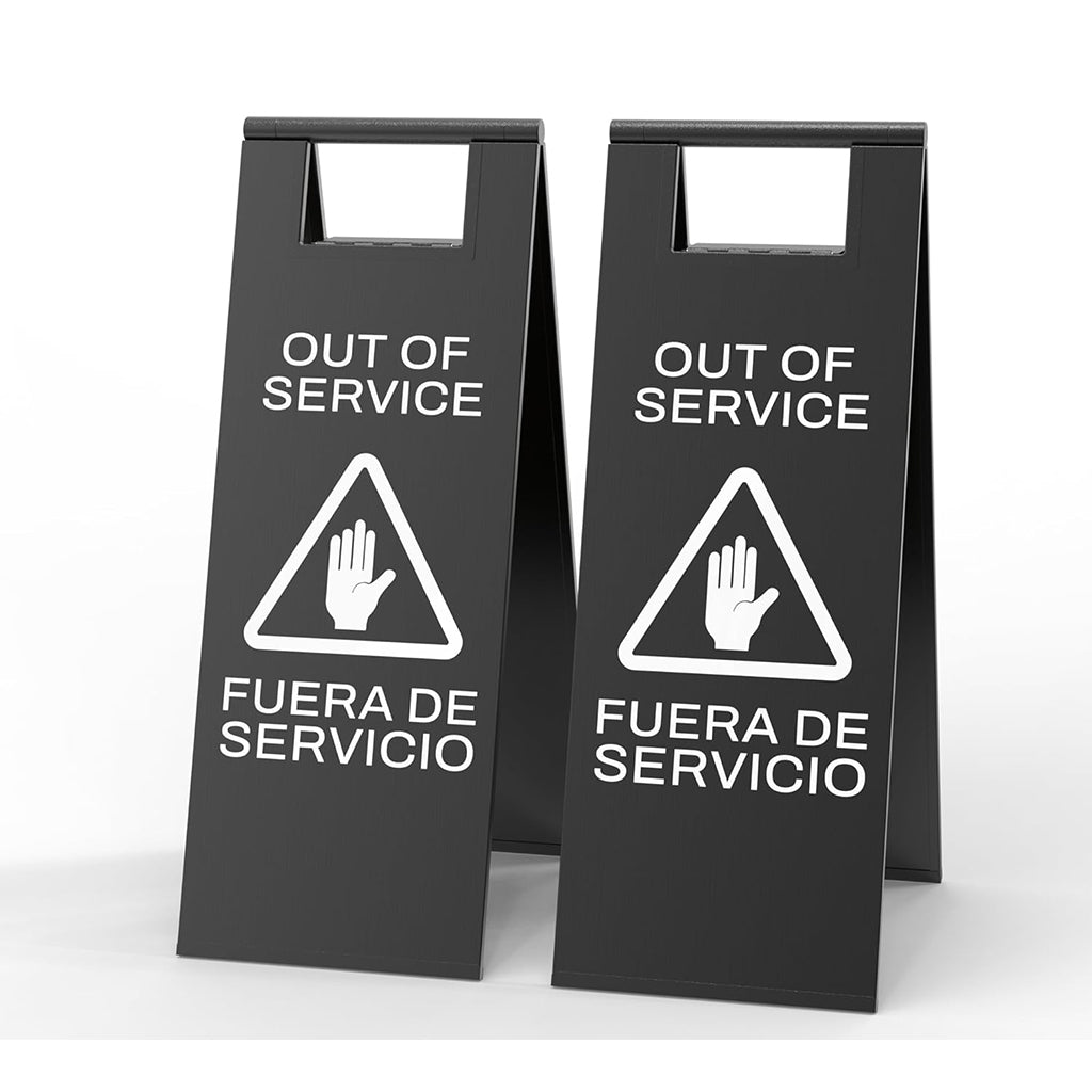 Two black out of service signs with triangular warning symbol and bilingual English Spanish text for equipment maintenance