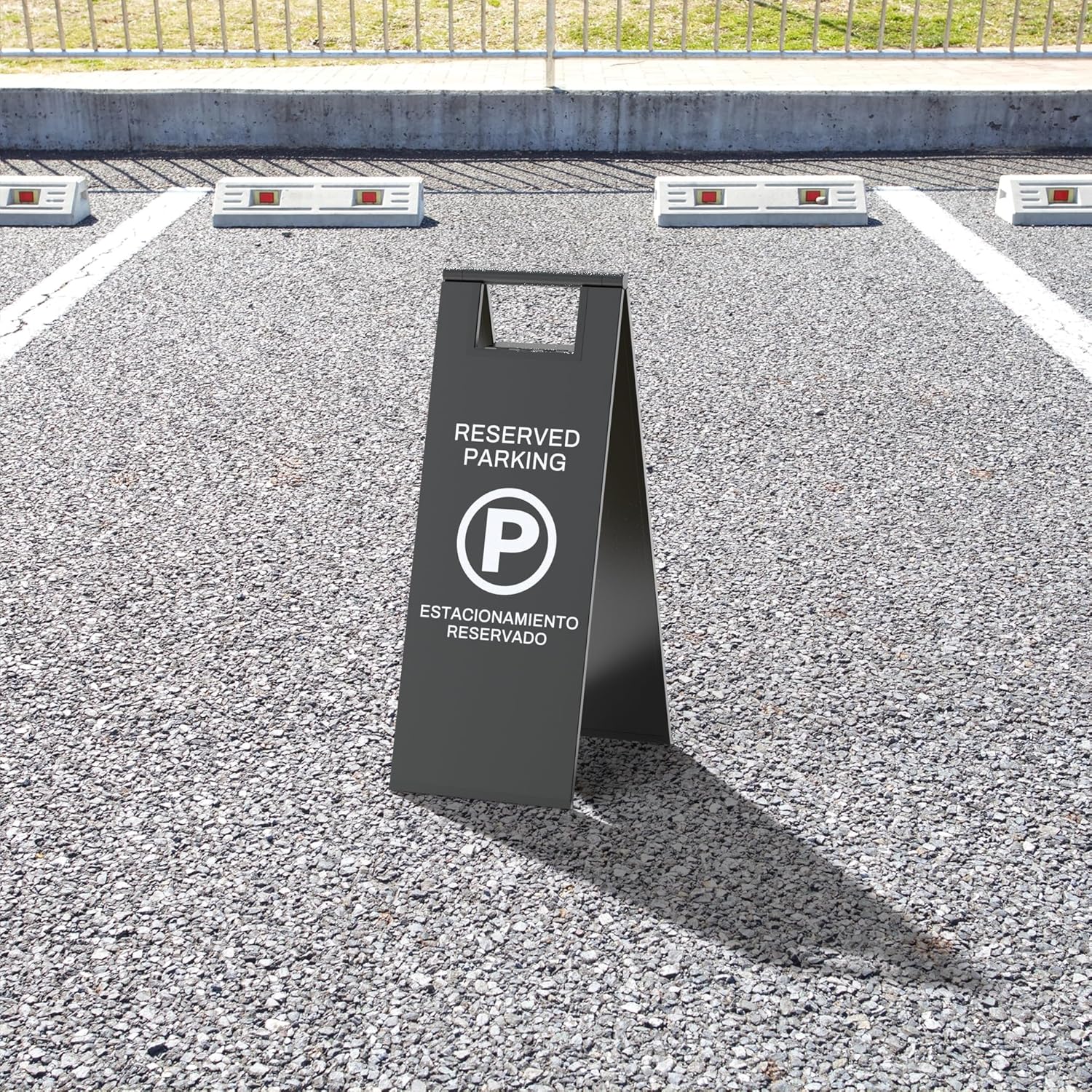 Reserved parking a-frame floor sign positioned in marked parking space showing effective parking management solution for businesses