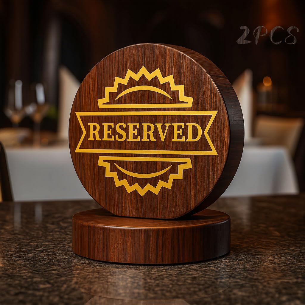 Elegant wooden reserved table sign with gold lettering on dark wood base, displayed in restaurant setting