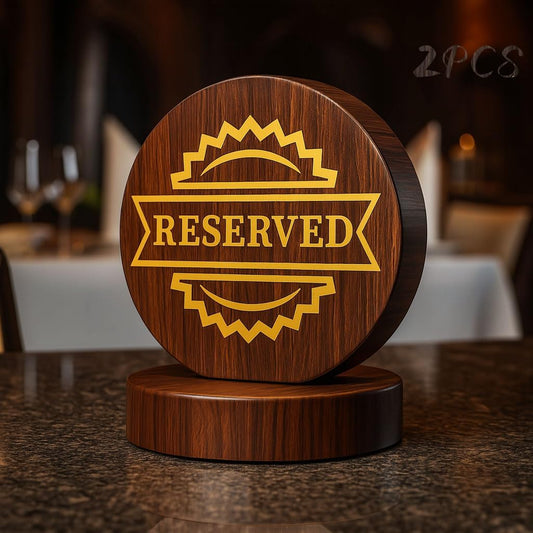 Elegant wooden reserved table sign with gold lettering on dark wood base, displayed in restaurant setting