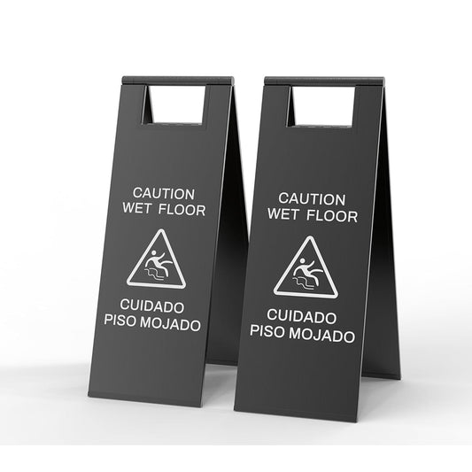 Modern black CAUTION WET FLOOR folding safety sign with white warning text and slip hazard icon - sleek caution sign for contemporary spaces