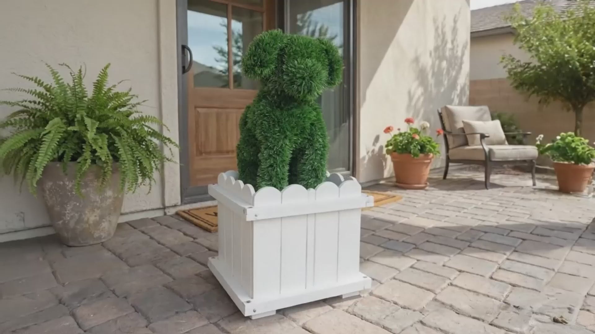 Load video: Artificial dog topiary in white planter box for front porch decor and outdoor entryway styling